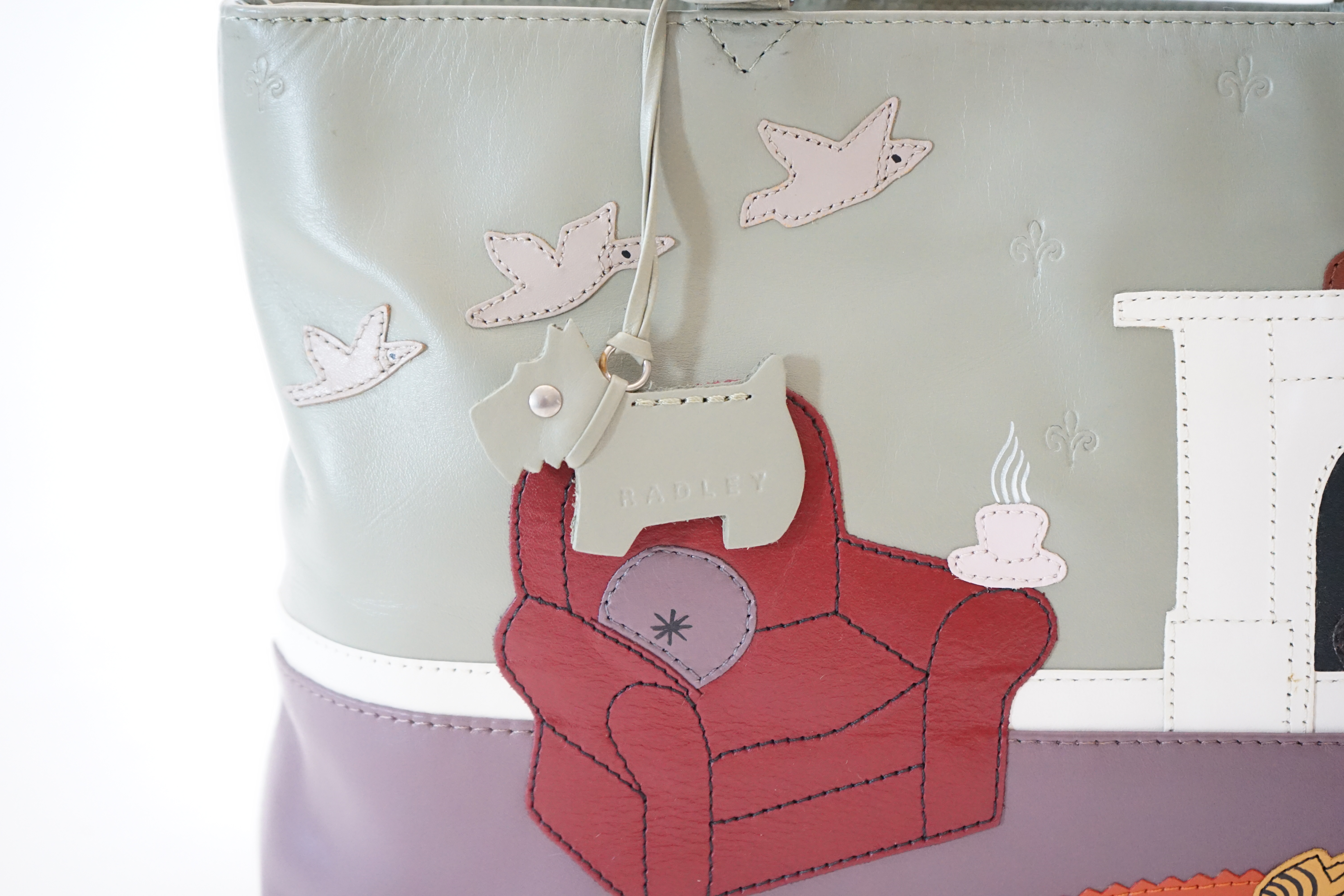 A Radley 'Armchair, Fireplace' leather grab handle bag, width 30cm, depth 8cm, height 19cm